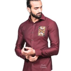 This is a burgundy long-sleeved shirt featuring a distinctive embroidered patch on the left chest that resembles a classic playing card