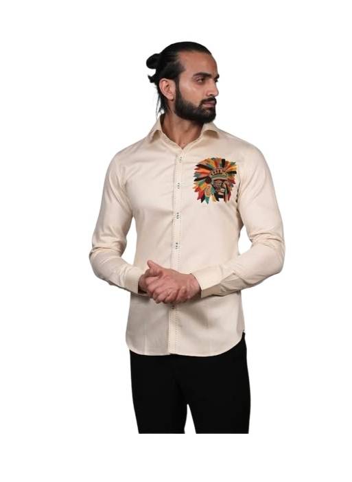Long-sleeved, collared shirt in a light, off-white, or cream color