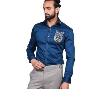 Deep blue long-sleeved shirt featuring a large, intricate, and colorful embroidered design of a stylized owl