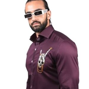 long-sleeved, collared shirt in a solid, deep burgundy or plum color