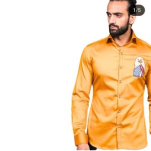 A men's long-sleeved, shiny yellow/goldenrod button-up shirt featuring an embroidered bald eagle head with an American flag design on the chest.