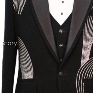 Black tuxedo with artistic silver sequin detailing and satin lapels, paired with a stylish waistcoat and embellished bow tie — perfect for receptions and grand events.